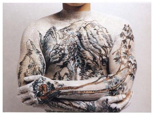 Guy with Chinese landscape tattoo in exhibition of Chinese contemporary art