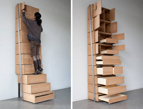 Staircase storage: vertical shelving unit is its own stepladder ...