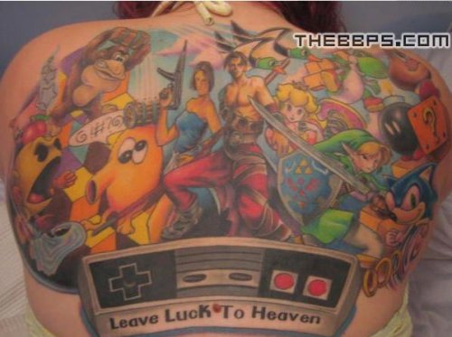 Now this is a gamertattoo a full backpiece framed by an NES controller 