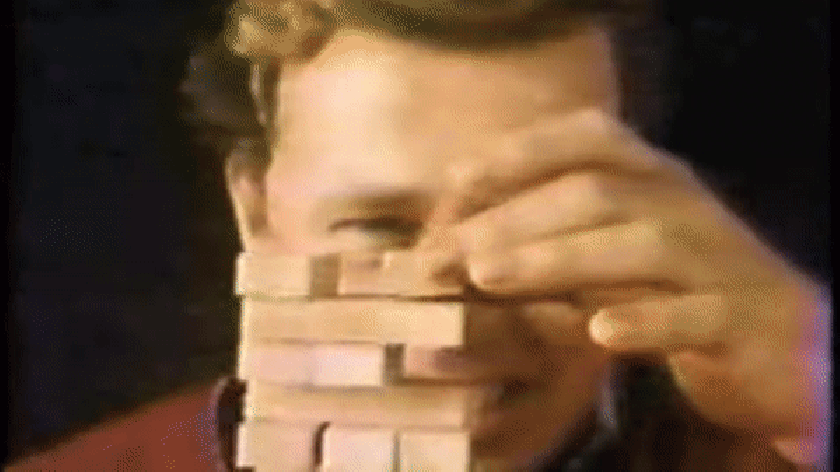 A clip from a Jenga ad showing a dad knocking over the Jenga tower.