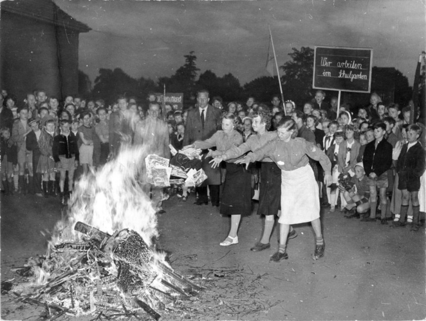 Burning of 'dirt and trash literature' at the 18th Elementary school in Berlin-Pankow (Buchholz), on the evening of International Children's Day, June 1st, 1955. It was the first of a wave of initiatives by the Parents-Teachers Association (Elternversammlungen), to legally ban 'trash and filth.'