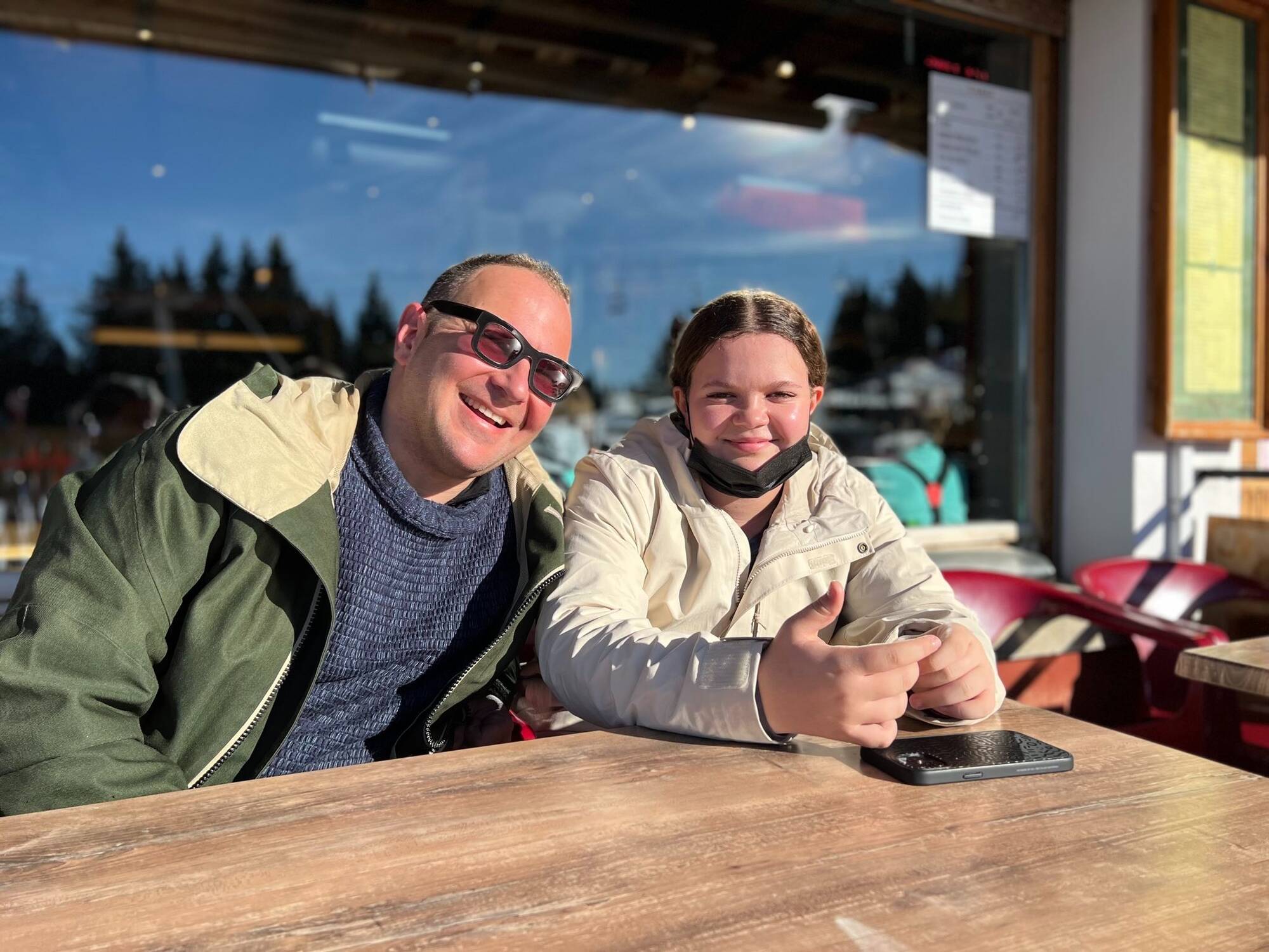 Poesy and I at a snack bar on a ski slope.